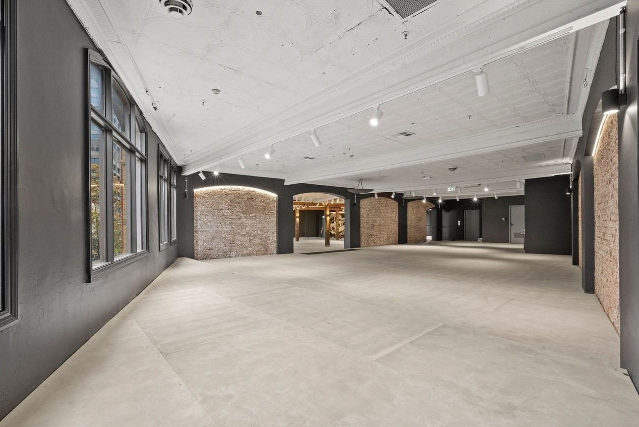 Empty space with arched brick recesses and grey walls