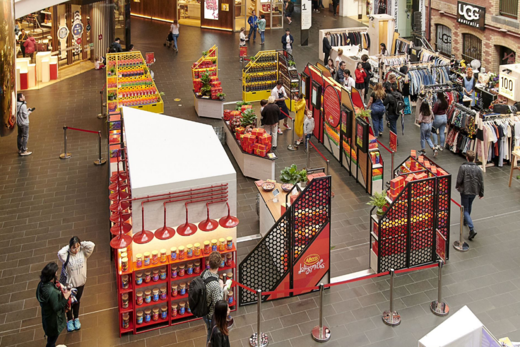 pop-up retail activation in shopping centre showcasing branded display and customer engagement zone