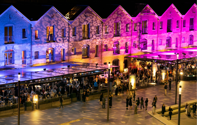Evening event venue with guests and lighting for live music and entertainment