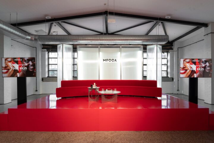 MECCA event lounge with seating and product tables