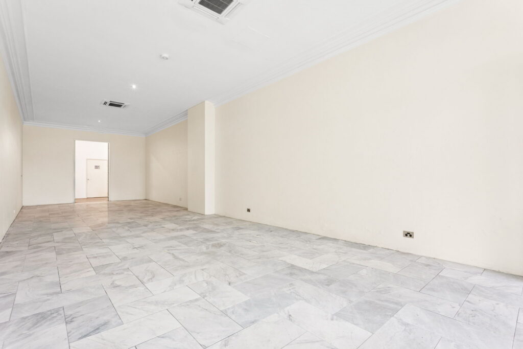 Open-plan retail space at 348 Darling Street, Balmain, with light walls and tiled floors