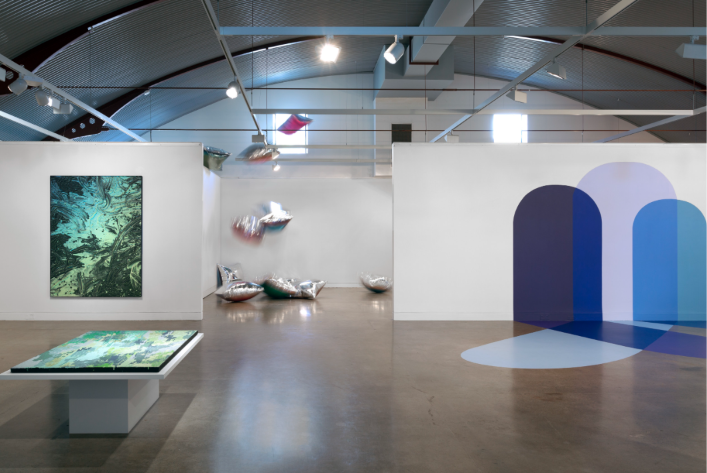 Event space set up for a press launch with open floor area and lighting