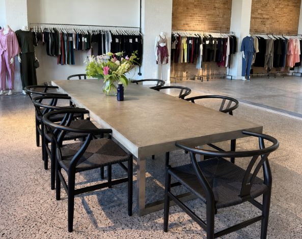 Modern showroom interior with product displays, seating and consultation space
